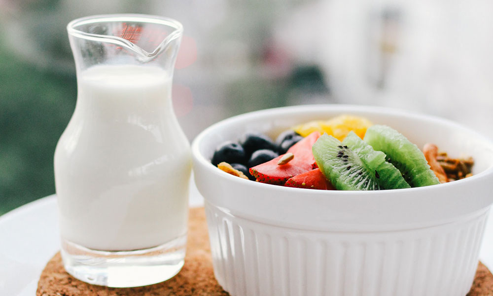 bottle of milk and fruit bowl